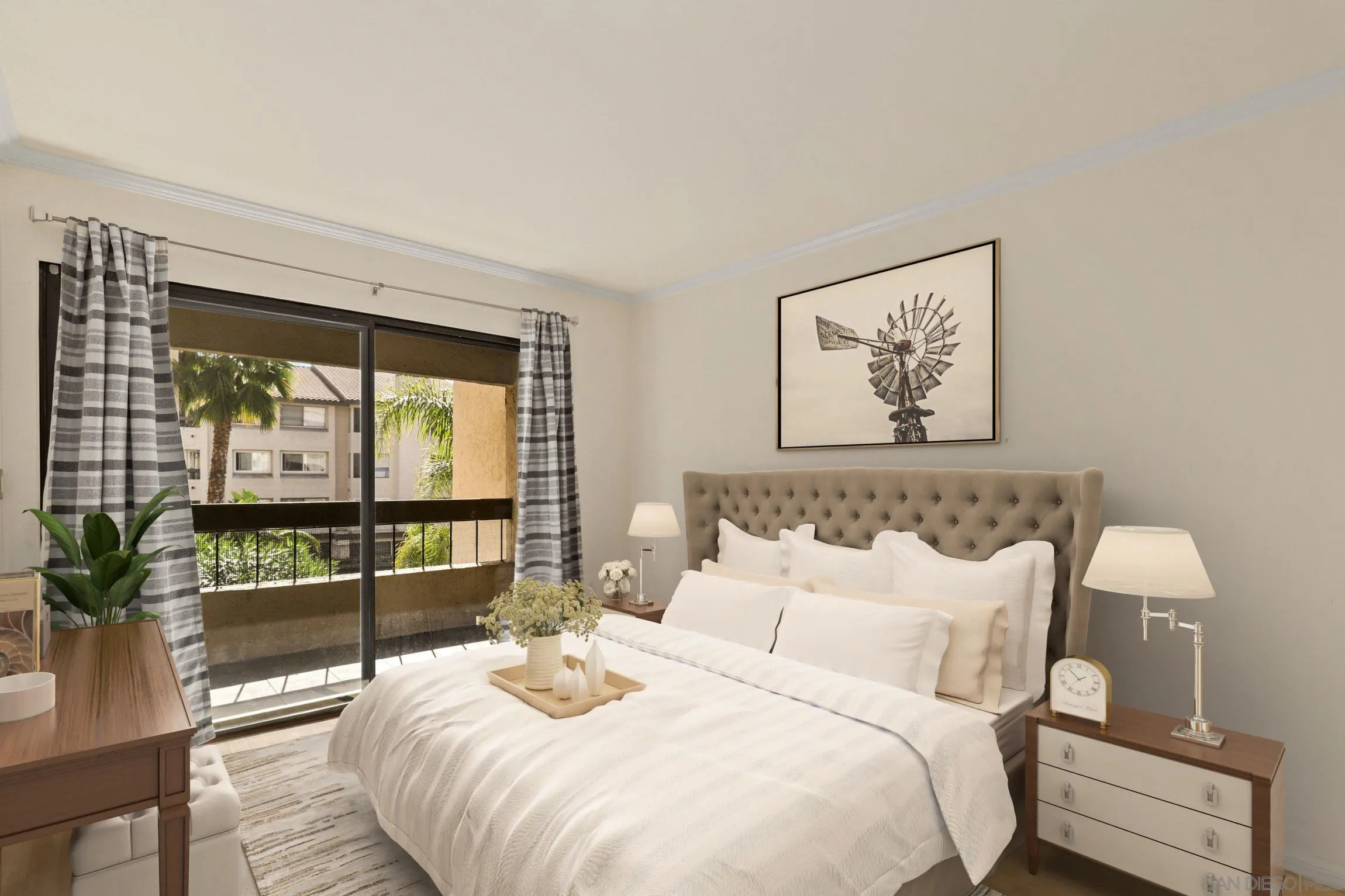 6757 Friars Road, Unit 13 San Diego, CA 92108 - Photo 9 of 15 a bedroom with a bed and a large window