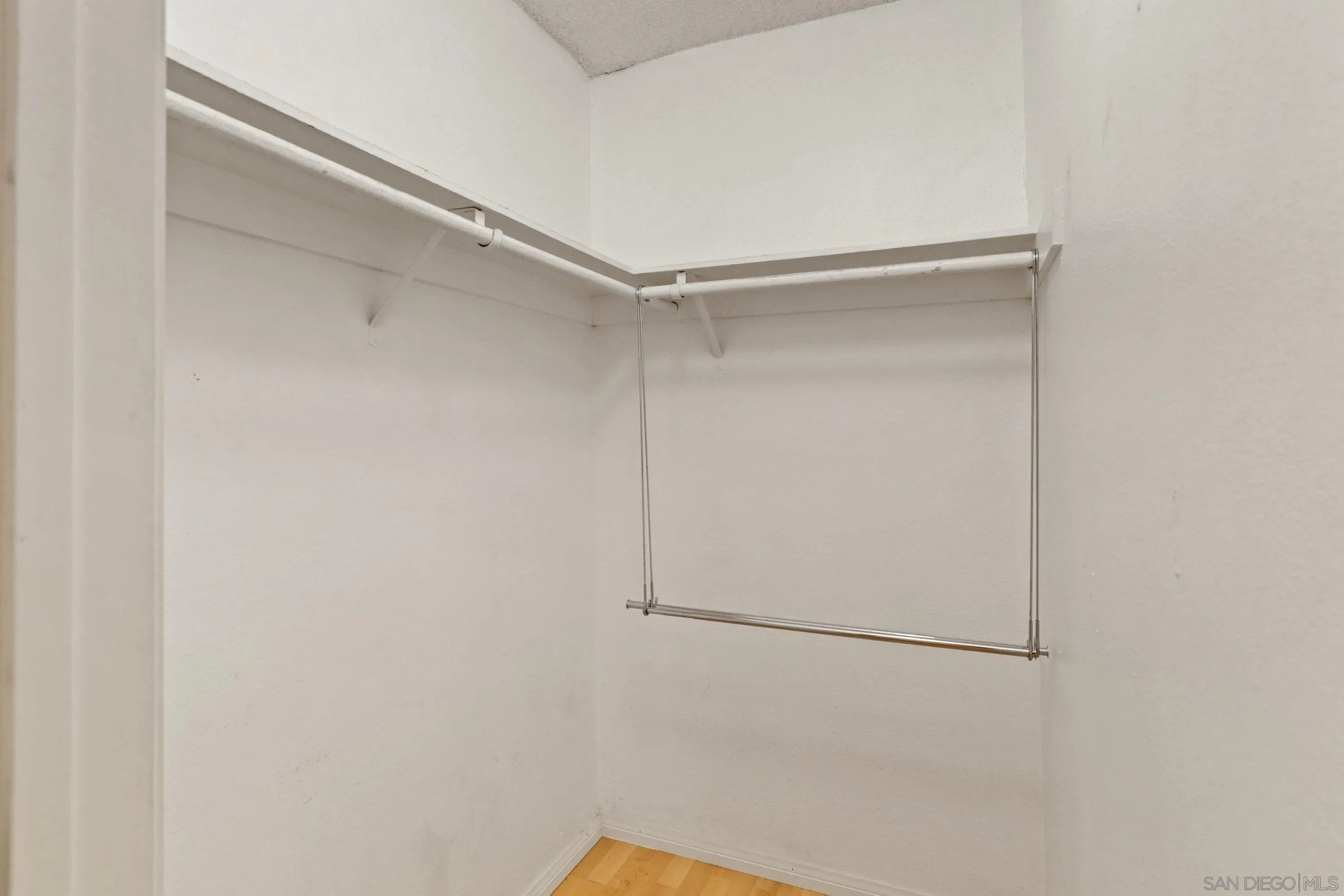 6757 Friars Road, Unit 13 San Diego, CA 92108 - Photo 10 of 15 a view of a room with racks on the wall