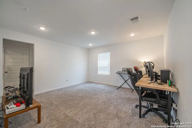a workspace with furniture and a window
