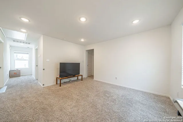 a bathroom with a shower a toilet and a sink