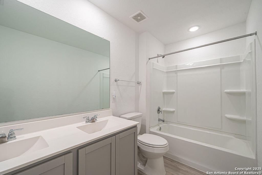 4422 Chandler Road, Unit 20 San Antonio, TX 78222 - Photo 20 of 38 a bathroom with a sink a toilet and shower