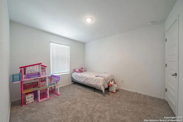 a bedroom with a bed and a cabinets