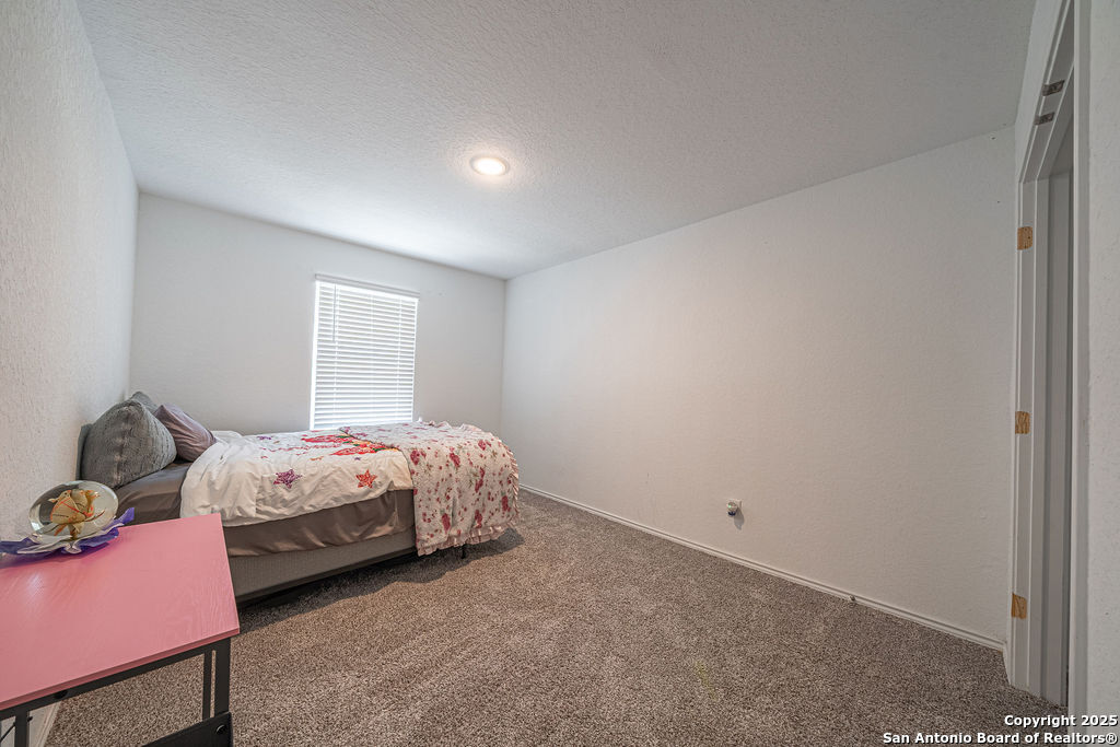 4422 Chandler Road, Unit 20 San Antonio, TX 78222 - Photo 23 of 38 a spacious bedroom with a bed and window