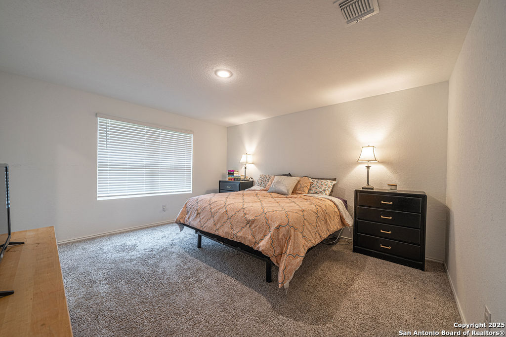 4422 Chandler Road, Unit 20 San Antonio, TX 78222 - Photo 25 of 38 a spacious bedroom with a bed and a window