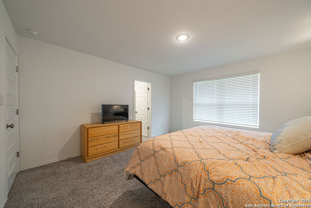 4422 Chandler Road, Unit 20 San Antonio, TX 78222 - Photo 26 of 38 a bedroom with a bed and a television