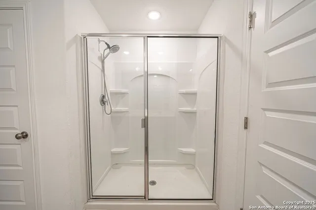 a bathroom with a sink double vanity and a bathtub