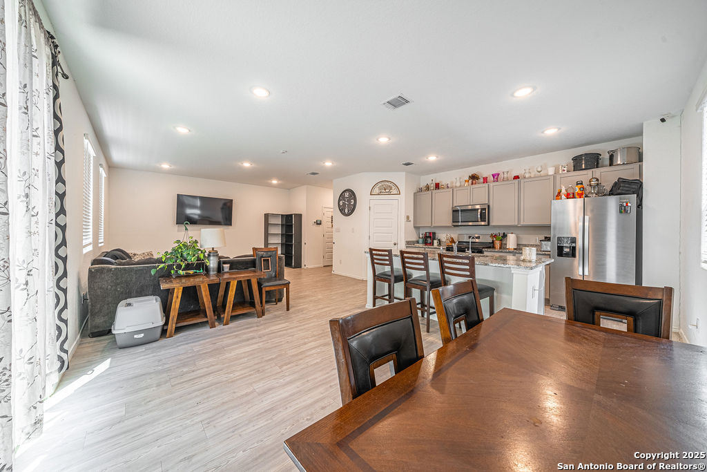 4422 Chandler Road, Unit 20 San Antonio, TX 78222 - Photo 7 of 38 a living room with lots of furniture and kitchen view with wooden floor