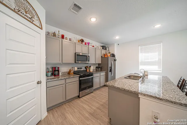 a kitchen with granite countertop lots of counter top space