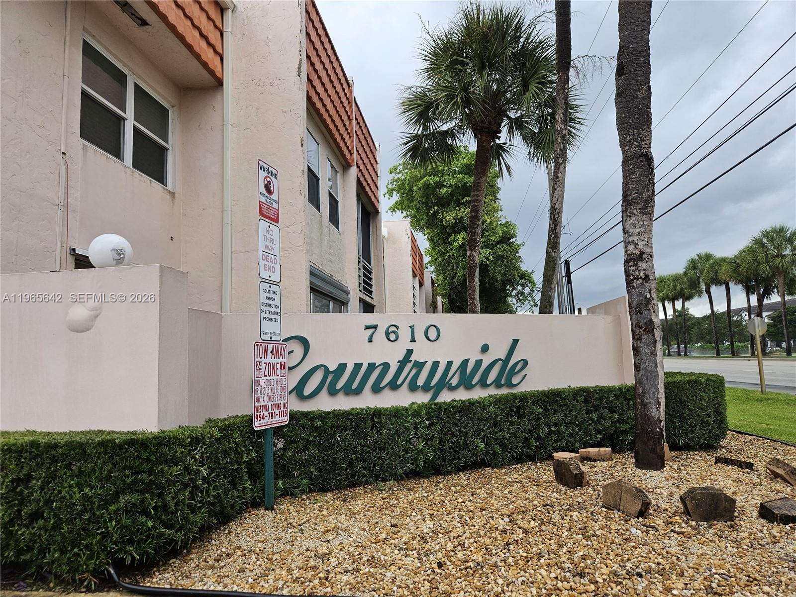 7610 Stirling Road, Unit 102C Davie, FL 33024 - Photo 2 of 11 a view of a street with potted plants