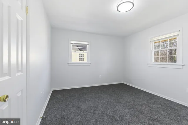 a view of empty room with windows