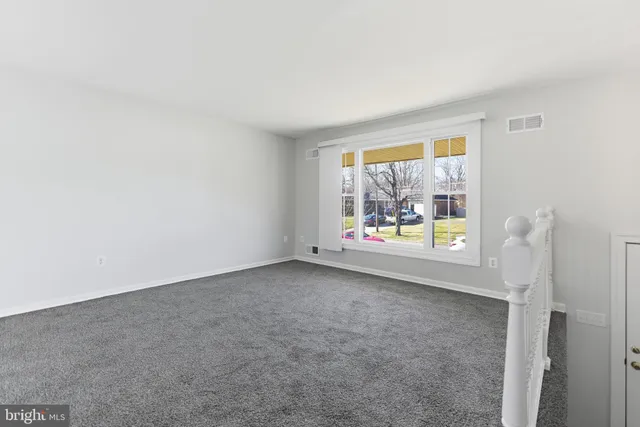 a view of empty room with windows