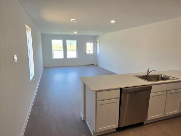 a view of a kitchen with a sink and dishwasher