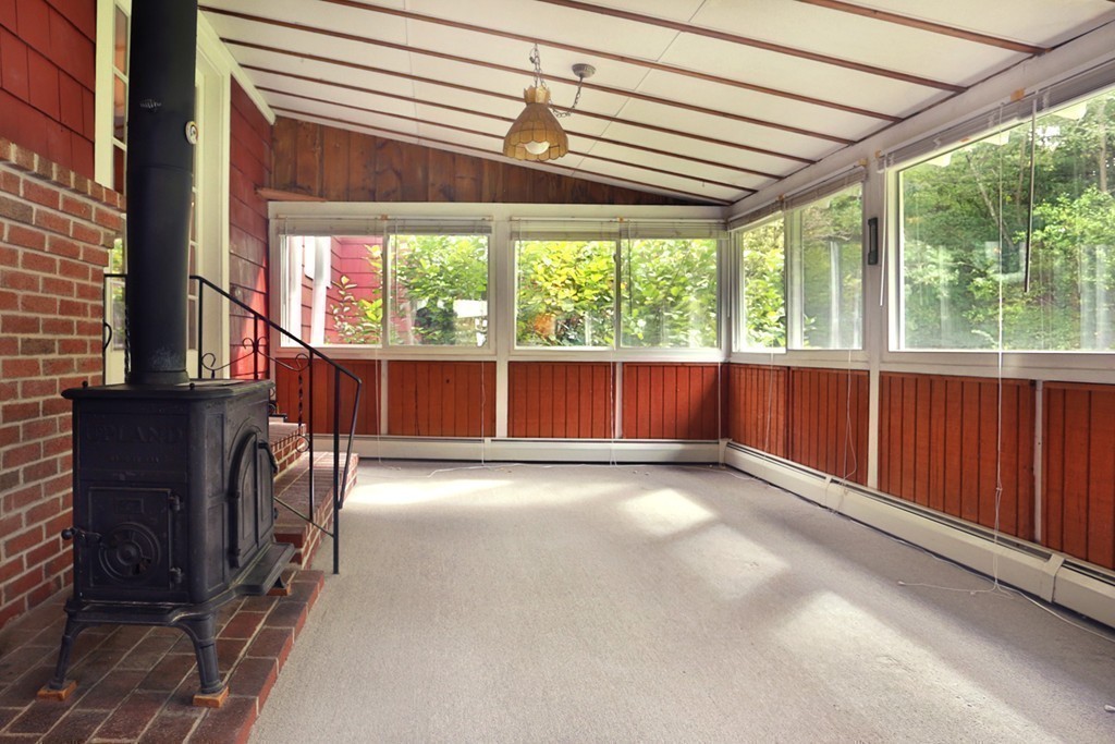 7 Stagecoach Road Topsfield, MA 01983 - Photo 20 of 26 an empty room with wooden floor and windows
