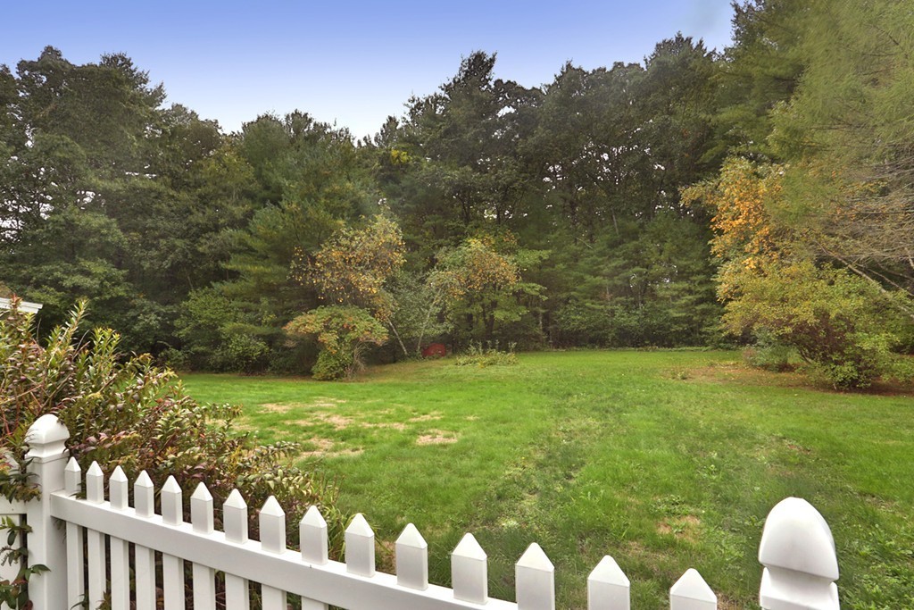 7 Stagecoach Road Topsfield, MA 01983 - Photo 6 of 26 a view of a wooden fence and trees in the background