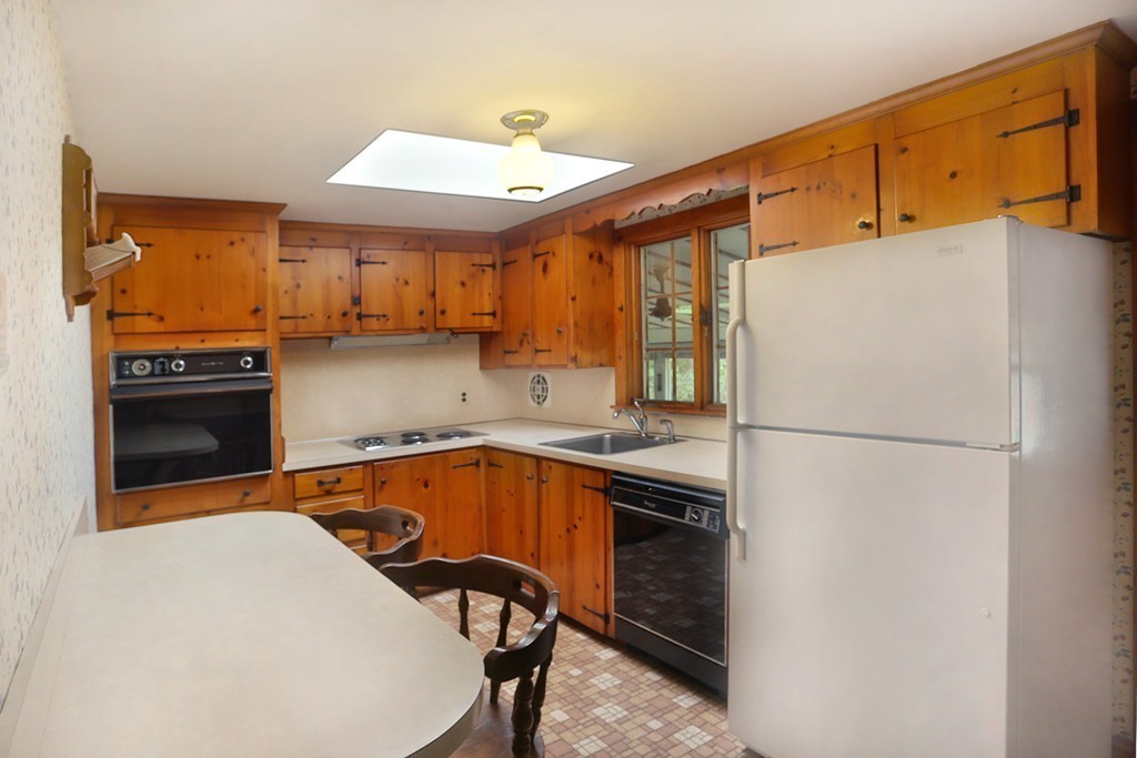 7 Stagecoach Road Topsfield, MA 01983 - Photo 7 of 26 a kitchen with a refrigerator a stove and a sink