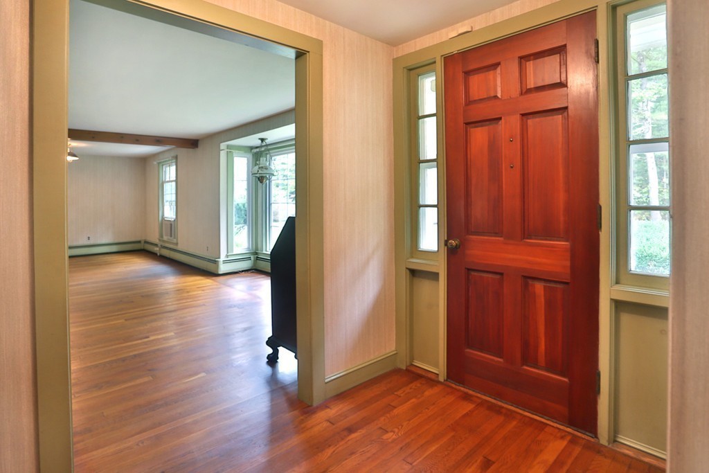 7 Stagecoach Road Topsfield, MA 01983 - Photo 9 of 26 an empty room with wooden floor and windows