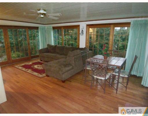 80 Stafford Road Colonia, NJ 07067 - Photo 6 of 10 a living room with furniture and large windows