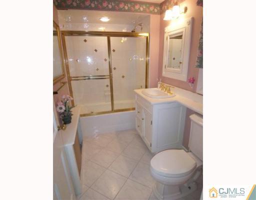 80 Stafford Road Colonia, NJ 07067 - Photo 8 of 10 a bathroom with a granite countertop sink toilet and shower