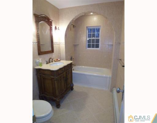 80 Stafford Road Colonia, NJ 07067 - Photo 9 of 10 a bathroom with a sink a toilet and shower