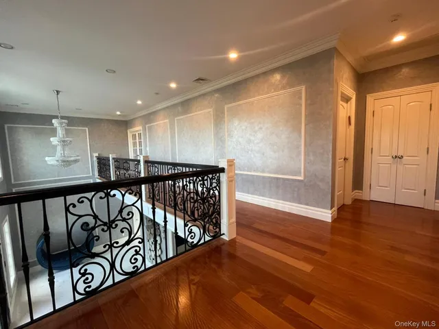 a view of an entryway with wooden floor