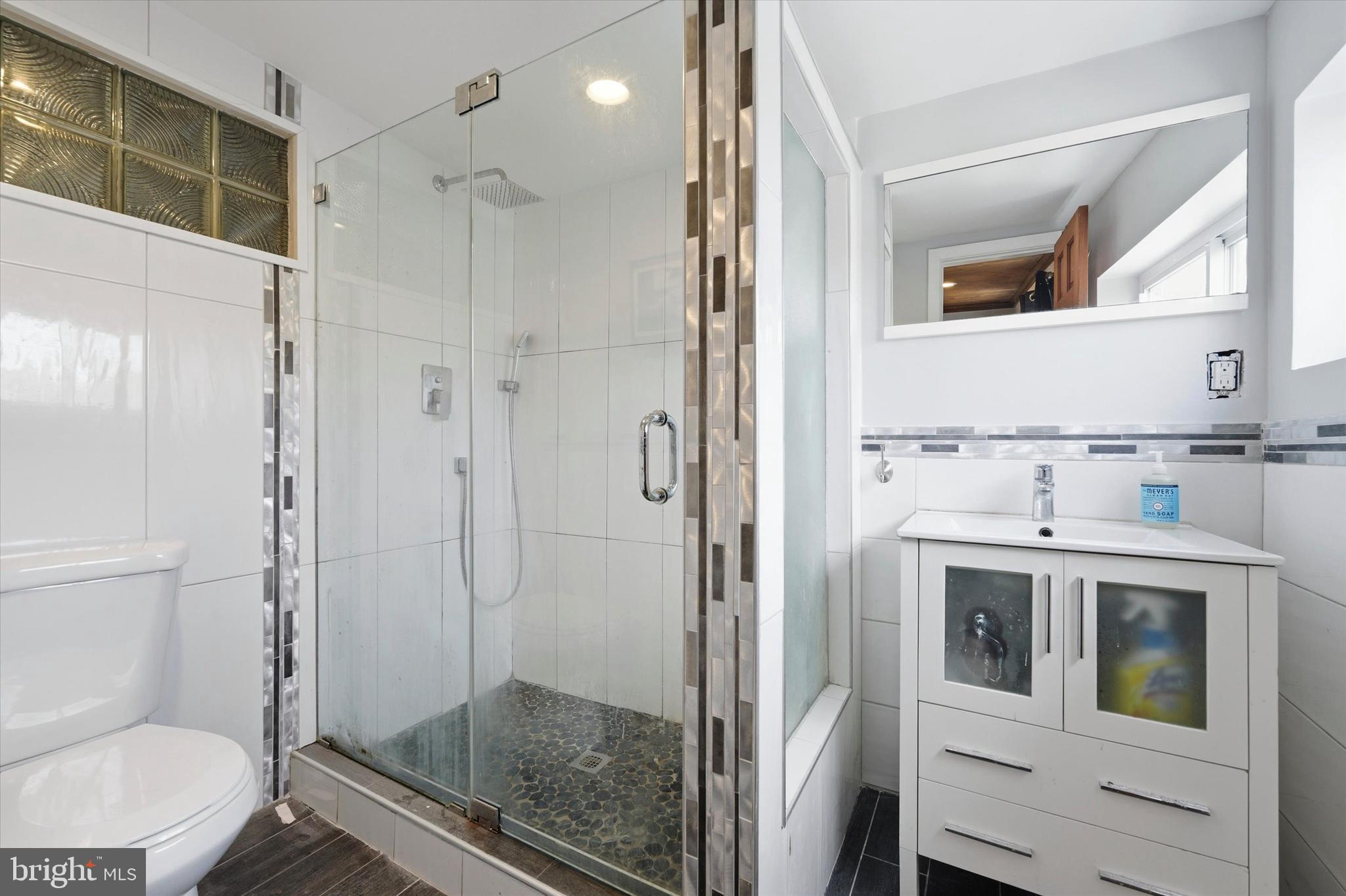 2152 East Letterly Street Philadelphia, PA 19125 - Photo 17 of 24 a bathroom with a shower a toilet and a sink