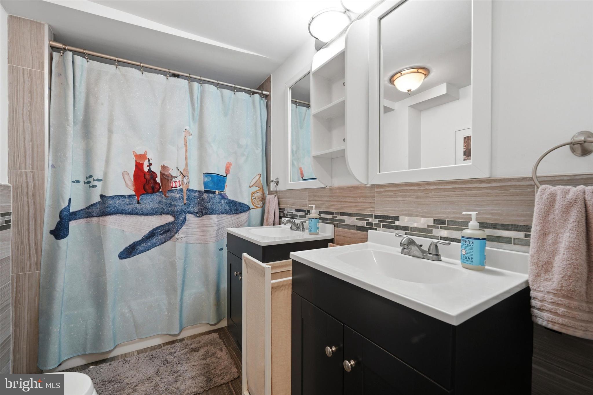 2152 East Letterly Street Philadelphia, PA 19125 - Photo 18 of 24 a kitchen with a sink cabinets and utility