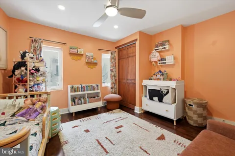 a bed room with a bed and a chair