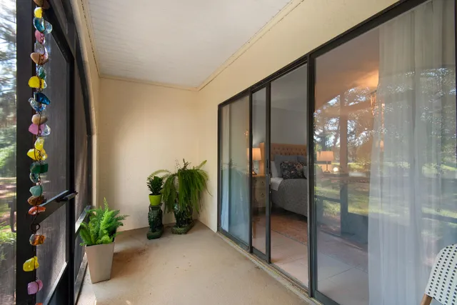a view of a room with a table and chairs