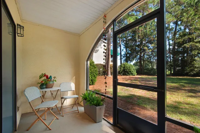 a view of a chairs and table in a patio