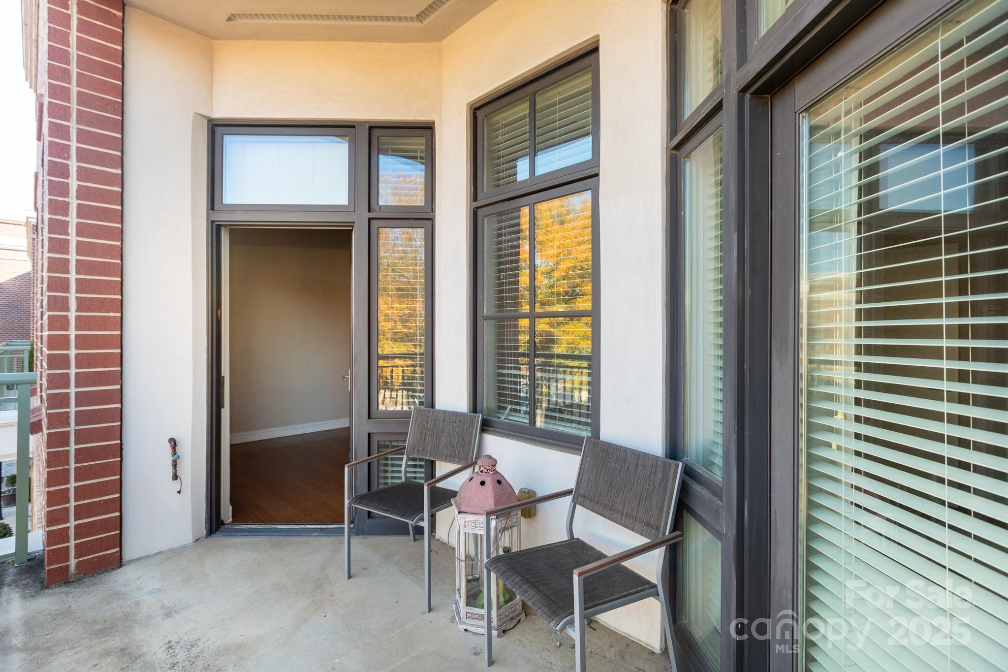 3920 Sharon Road Charlotte, NC 28211 - Photo 22 of 38 a view of an outdoor space with a dining table and chairs