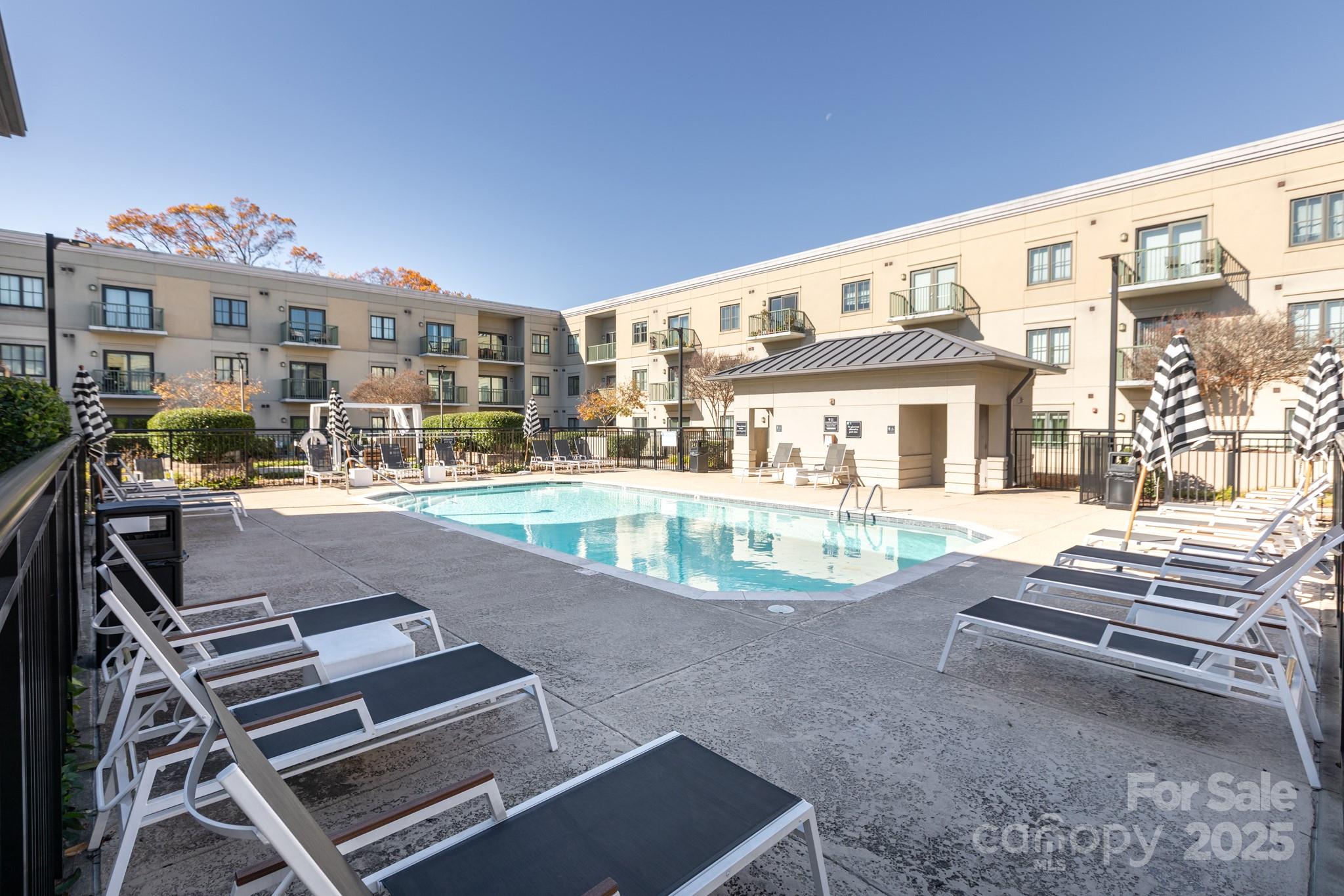 3920 Sharon Road Charlotte, NC 28211 - Photo 29 of 38 a view of a building with a swimming pool