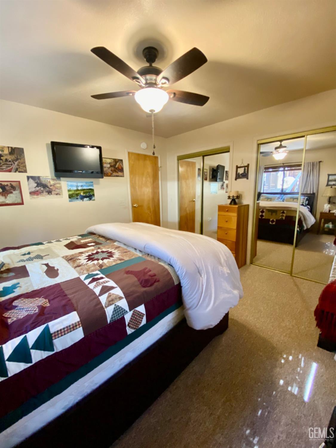 Undisclosed Address Posey, CA 93260 - Photo 16 of 35 a bedroom with a bed and a chandelier