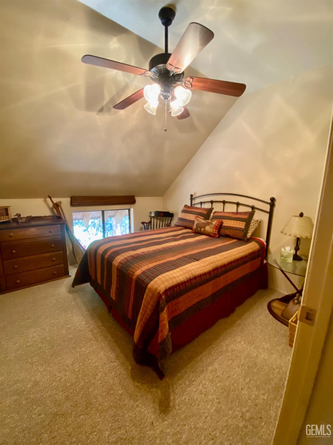 Undisclosed Address Posey, CA 93260 - Photo 24 of 35 a bedroom with bed and a chandelier