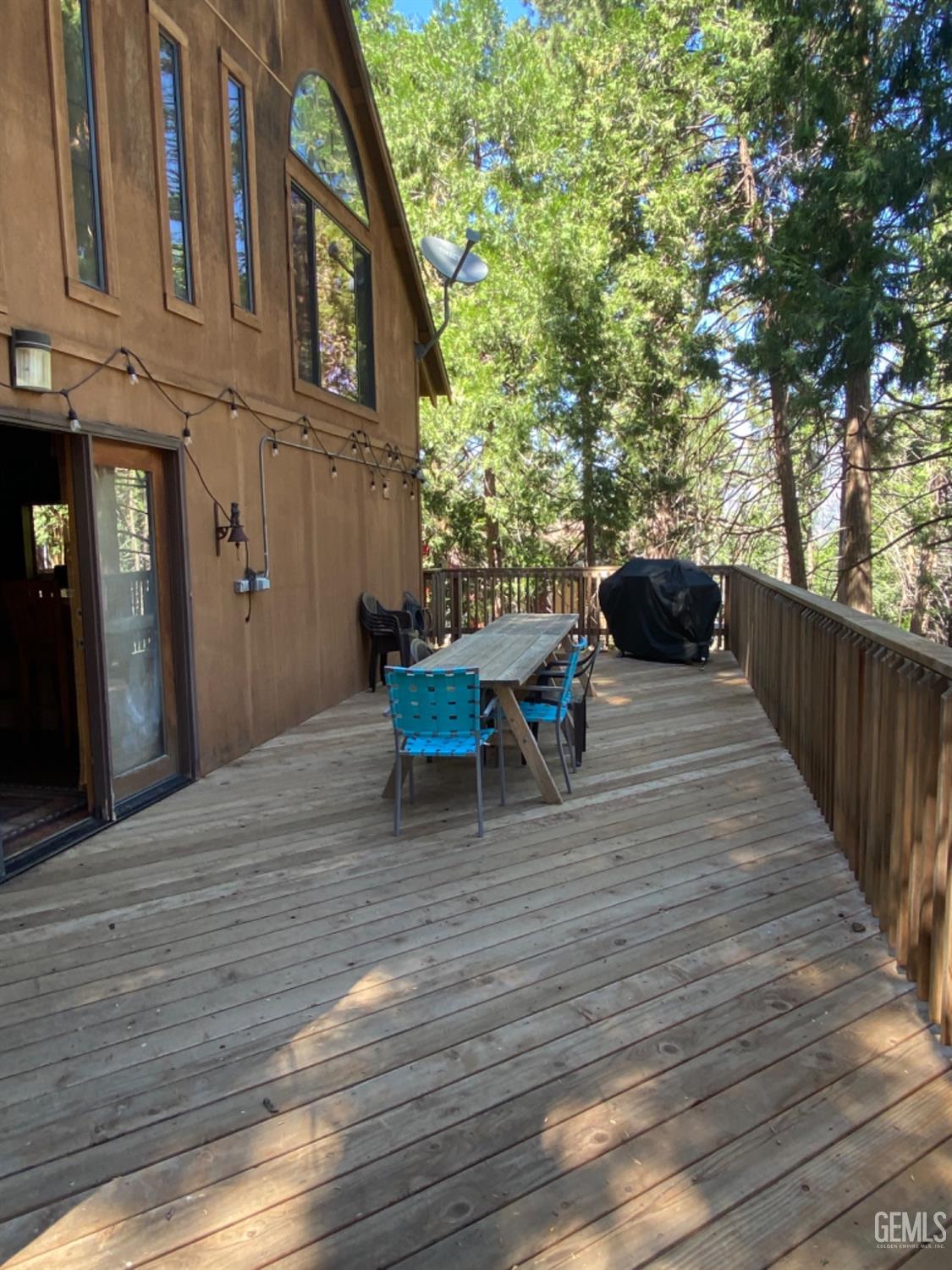 Undisclosed Address Posey, CA 93260 - Photo 29 of 35 a backyard of a house with wooden floor yard barbeque oven and outdoor seating