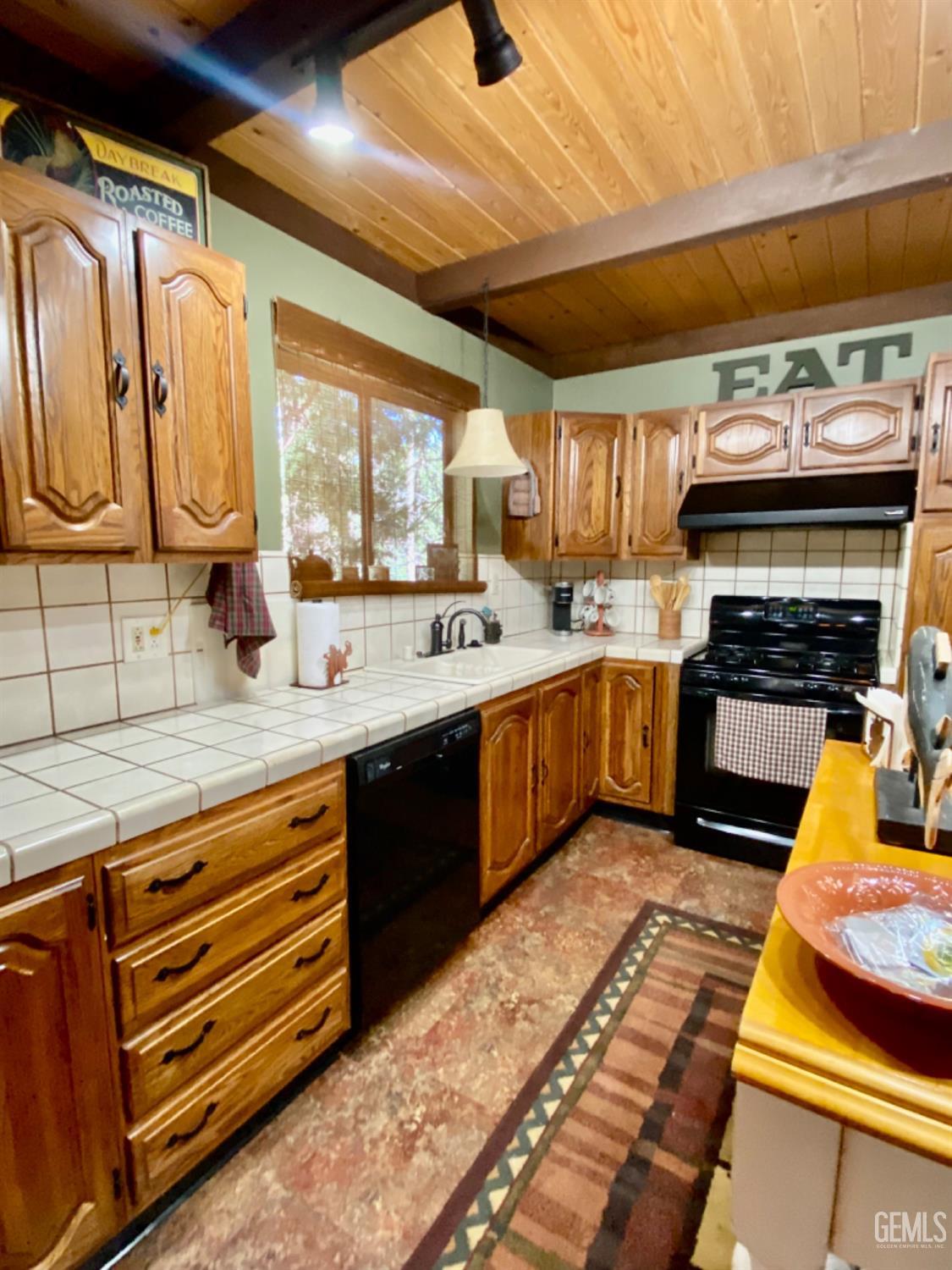 Undisclosed Address Posey, CA 93260 - Photo 8 of 35 a kitchen with stainless steel appliances kitchen island granite countertop a sink and cabinets