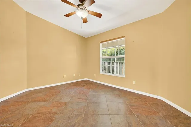 a kitchen with granite countertop white cabinets and a sink