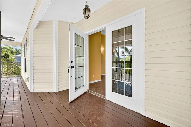 a view of an entryway with a room and chandelier