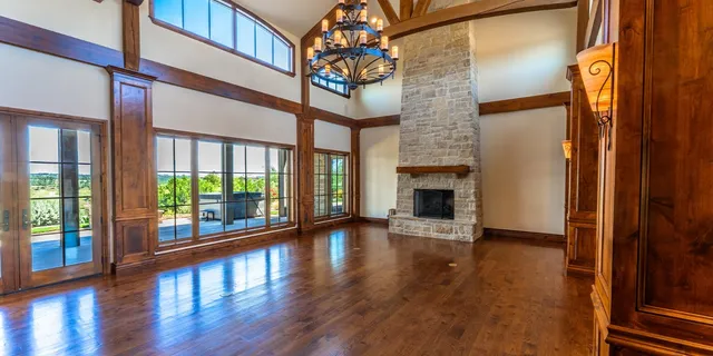 a view of an entryway with wooden floor a door and a window