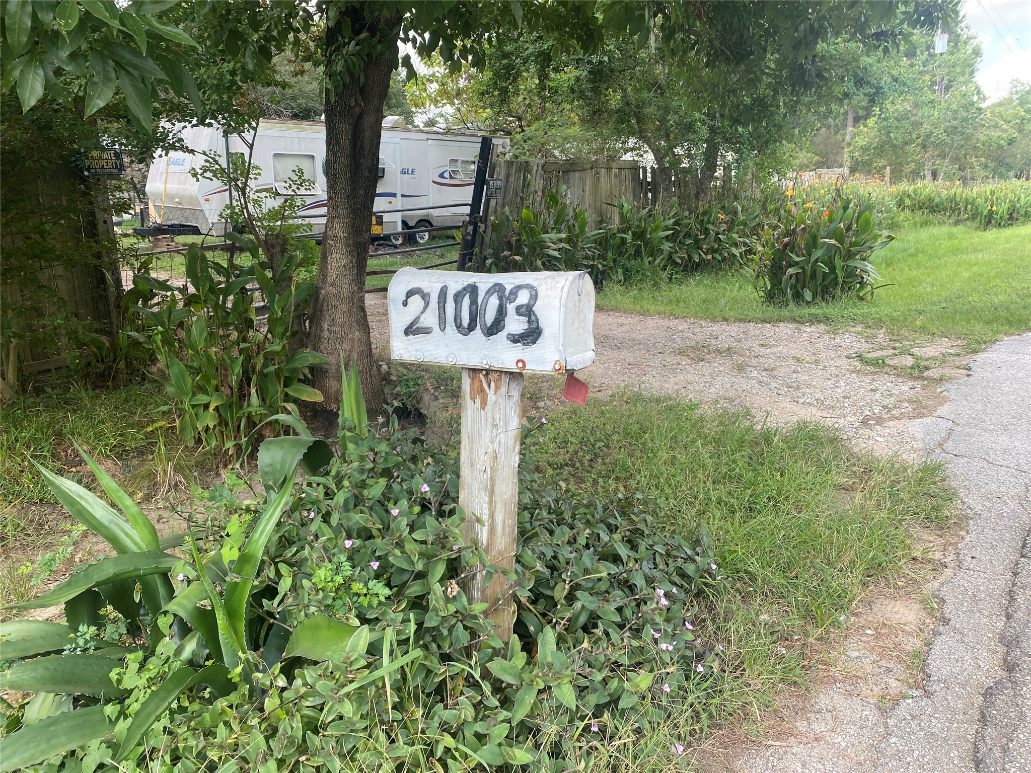 21003 Cook Road Tomball, TX 77377 - Photo 4 of 8 a sign that is sitting in the middle of a park