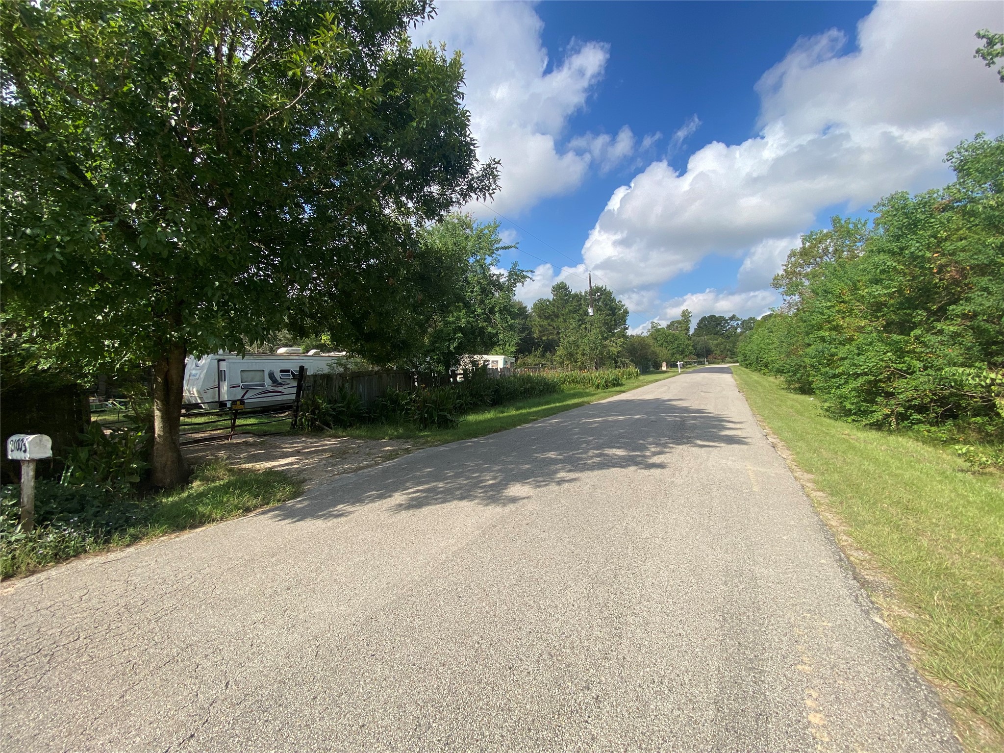 21003 Cook Road Tomball, TX 77377 - Photo 8 of 8 a view of a street with a yard