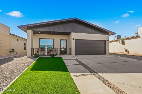 a front view of a house with yard