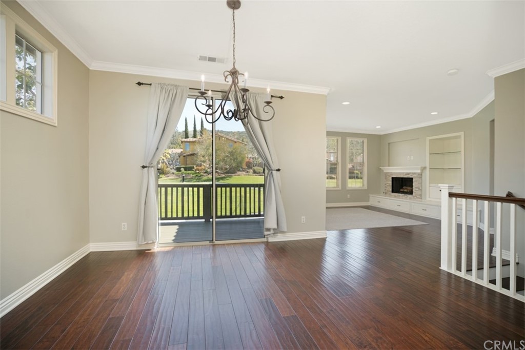 10108 Marchant Avenue Tustin, CA 92782 - Photo 4 of 15 a view of empty room with wooden floor and fan
