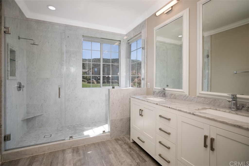 10108 Marchant Avenue Tustin, CA 92782 - Photo 6 of 15 a bathroom with a granite countertop sink mirror and shower