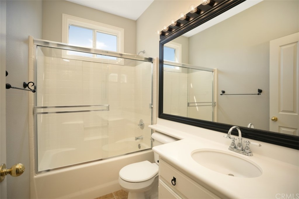 10108 Marchant Avenue Tustin, CA 92782 - Photo 10 of 15 a bathroom with a sink toilet and shower