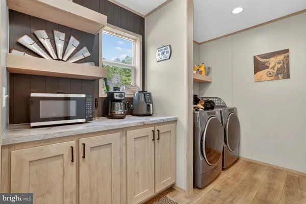 a kitchen with a washer and dryer