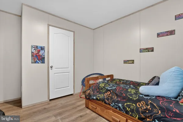 a bedroom with bed and a window