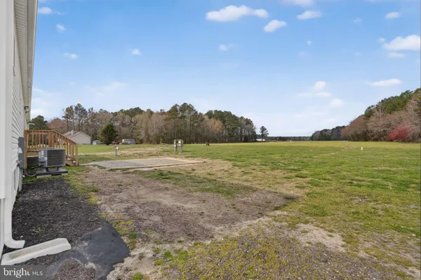 a view of a field with an ocean view