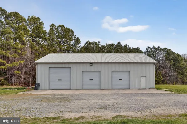 a view of an house with a yard and garage