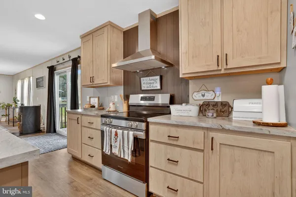 a kitchen with stainless steel appliances granite countertop a stove and a sink