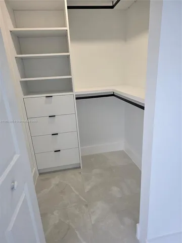 wooden floor and closet in a bathroom